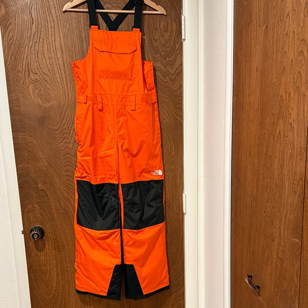 The North Face Kids Bright Orange Bib Pants